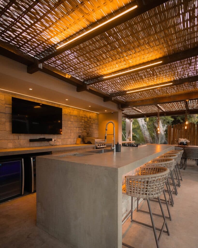 Modern outdoor kitchen with bar and seating